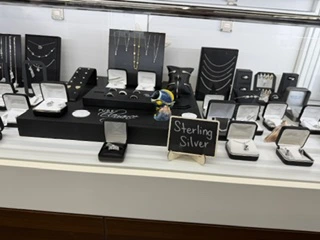 Sterling silver necklaces, rings, and other jewelry in our display case